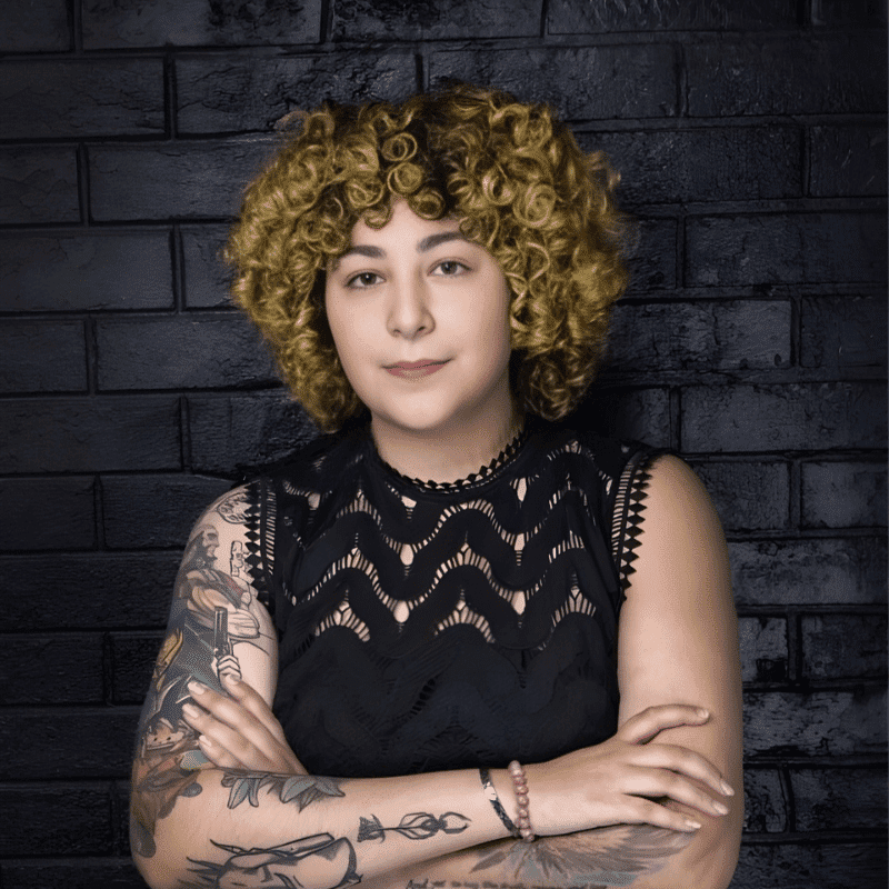 Portrait of Dani Benetiz, a professional stylist at Educe Salon, showcasing their expertise and style.