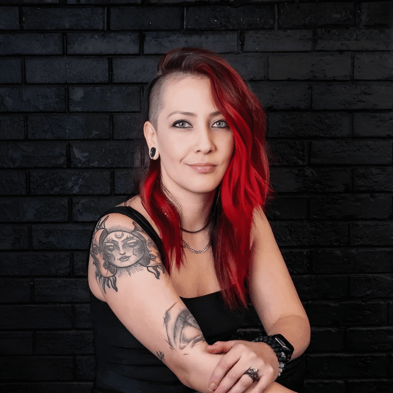 Portrait of Valerie Zirkle, a professional stylist at Educe Salon, showcasing their expertise and style.