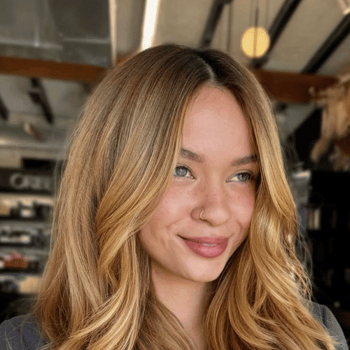 Portrait of Nicol Garcia, a professional stylist at Educe Salon, showcasing their expertise and style.